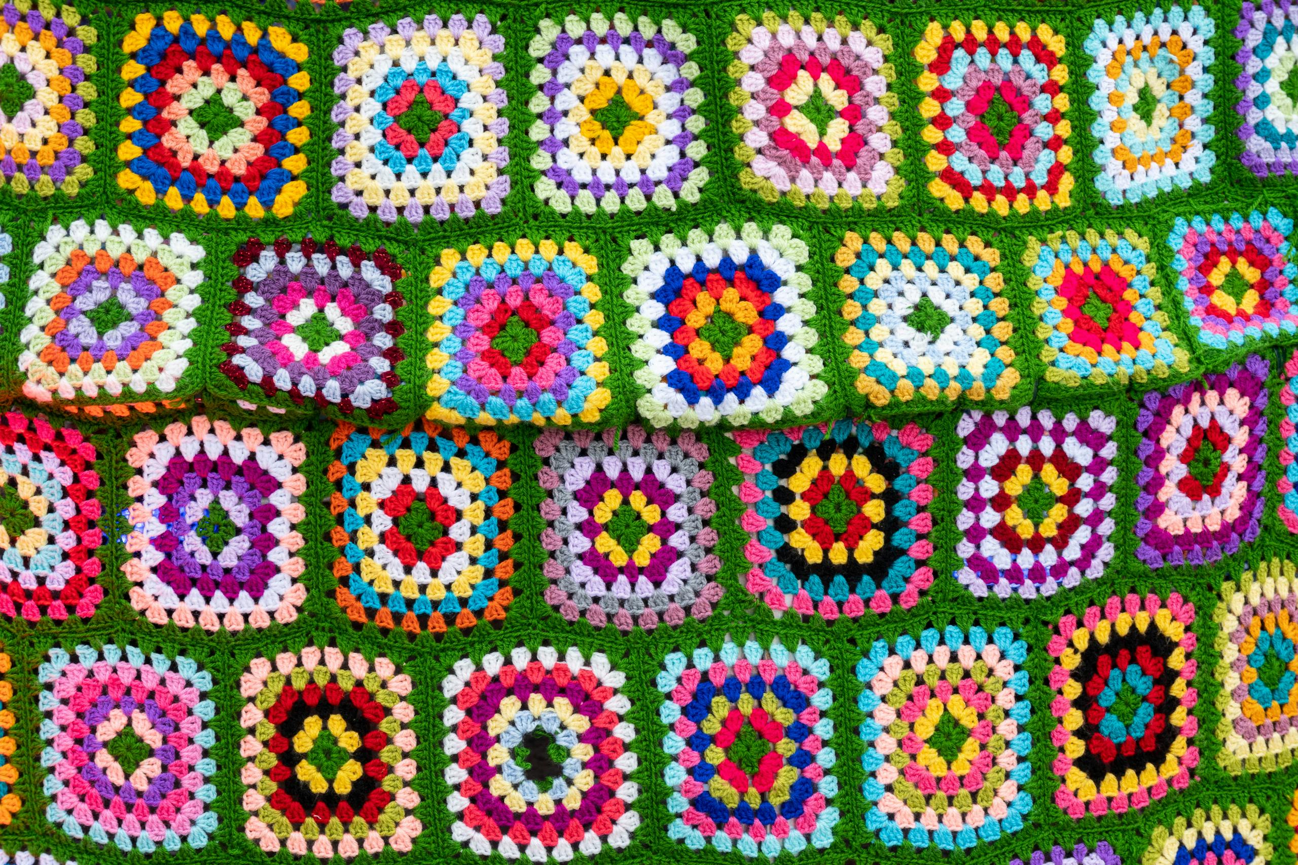 Vibrant crochet afghan with geometric patterns in Palermo, Italy.